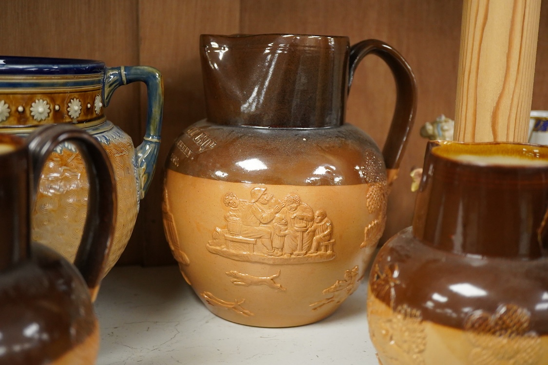 Four graduated Royal Doulton harvest jugs and a Royal Doulton Lambeth three footed jardiniere- 17cm high